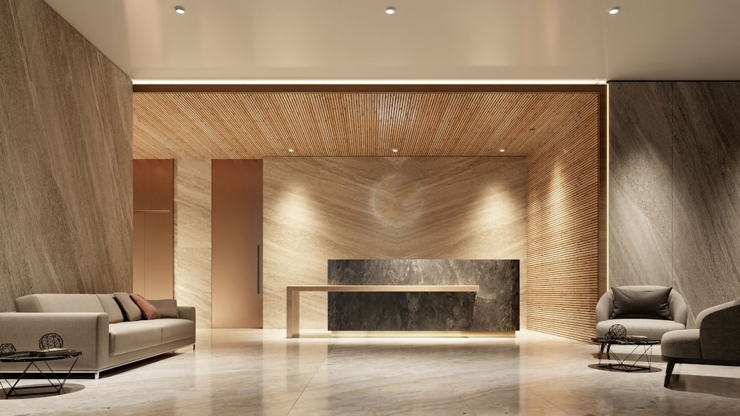 Modern office reception area with wooden desk