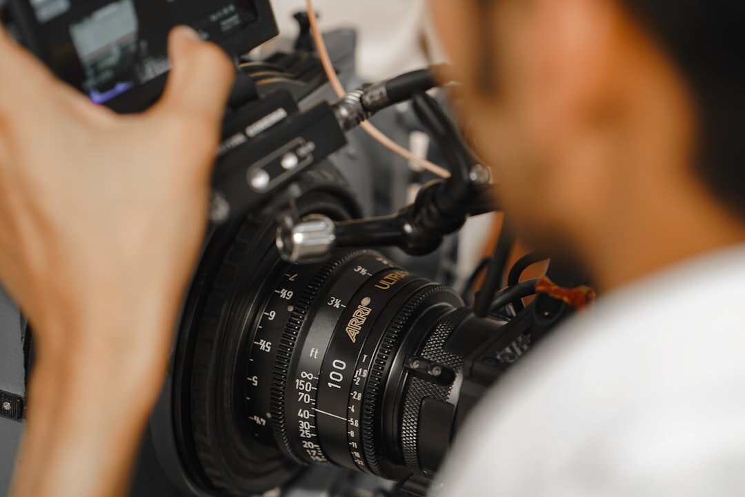 Close-up of a professional camera lens during a live broadcast