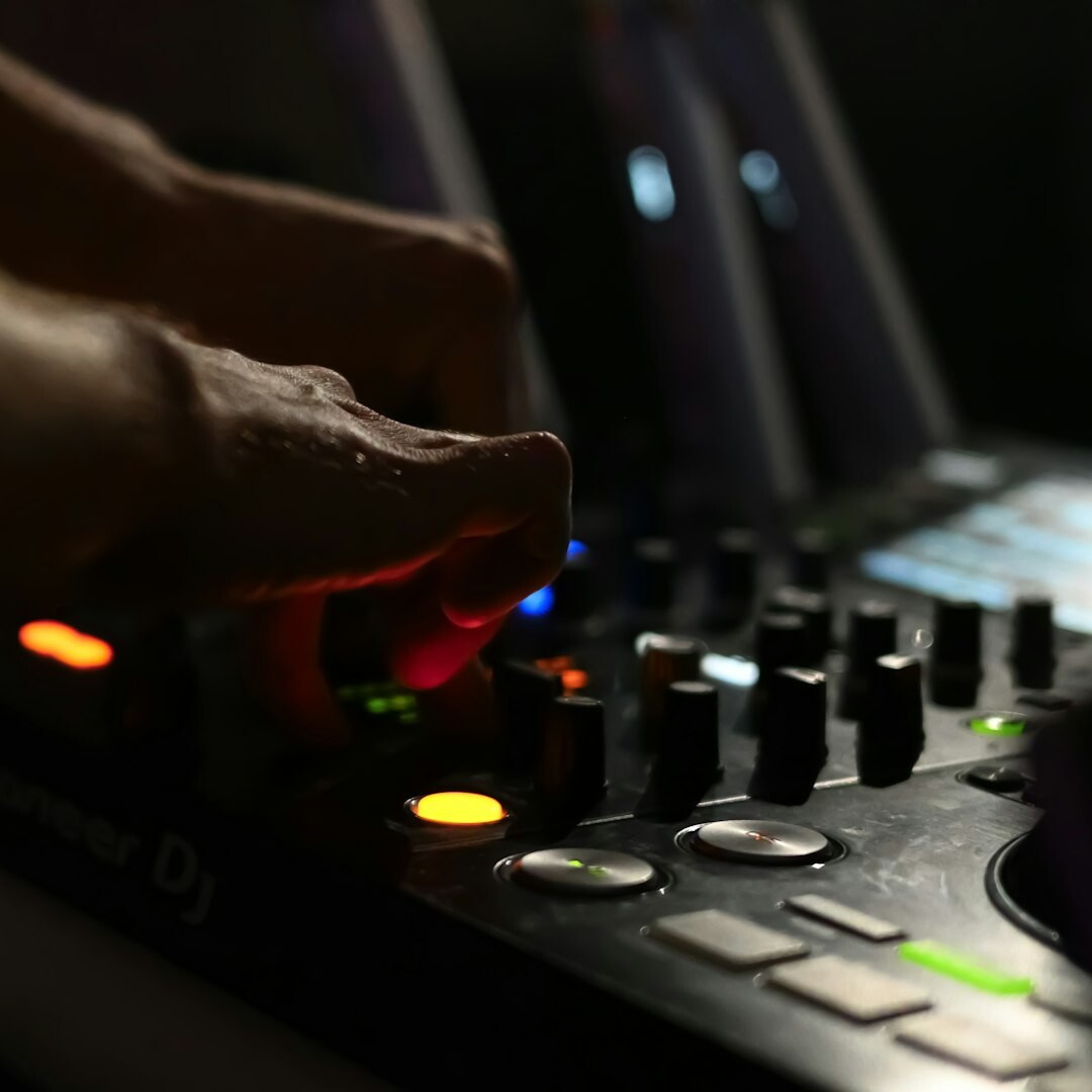 Finnish woman adjusting audio mixing console during a live stream