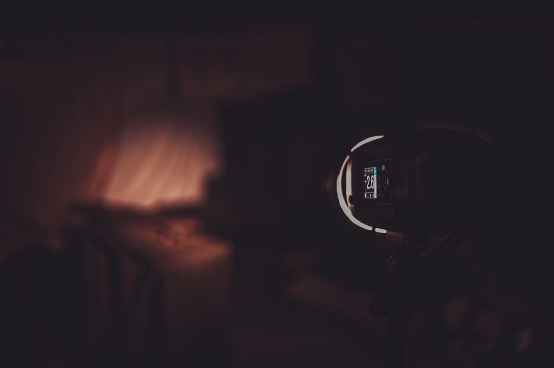 Professional video camera on a tripod recording in a studio